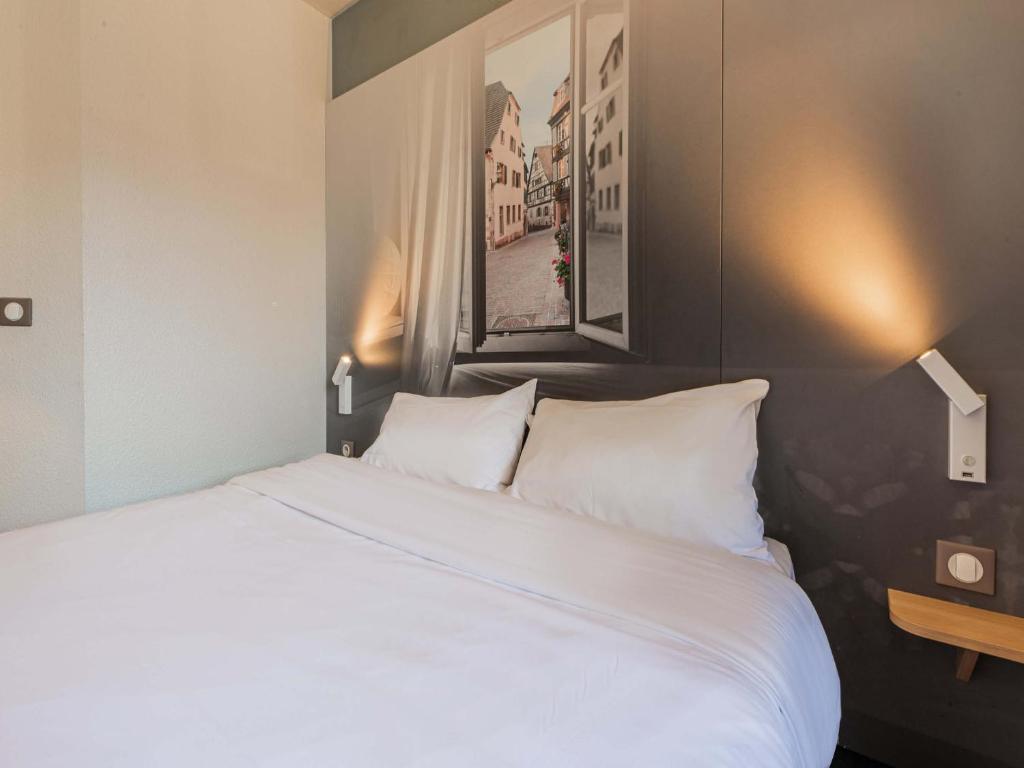 Postel nebo postele na pokoji v ubytování B&B HOTEL Strasbourg Sud Ostwald