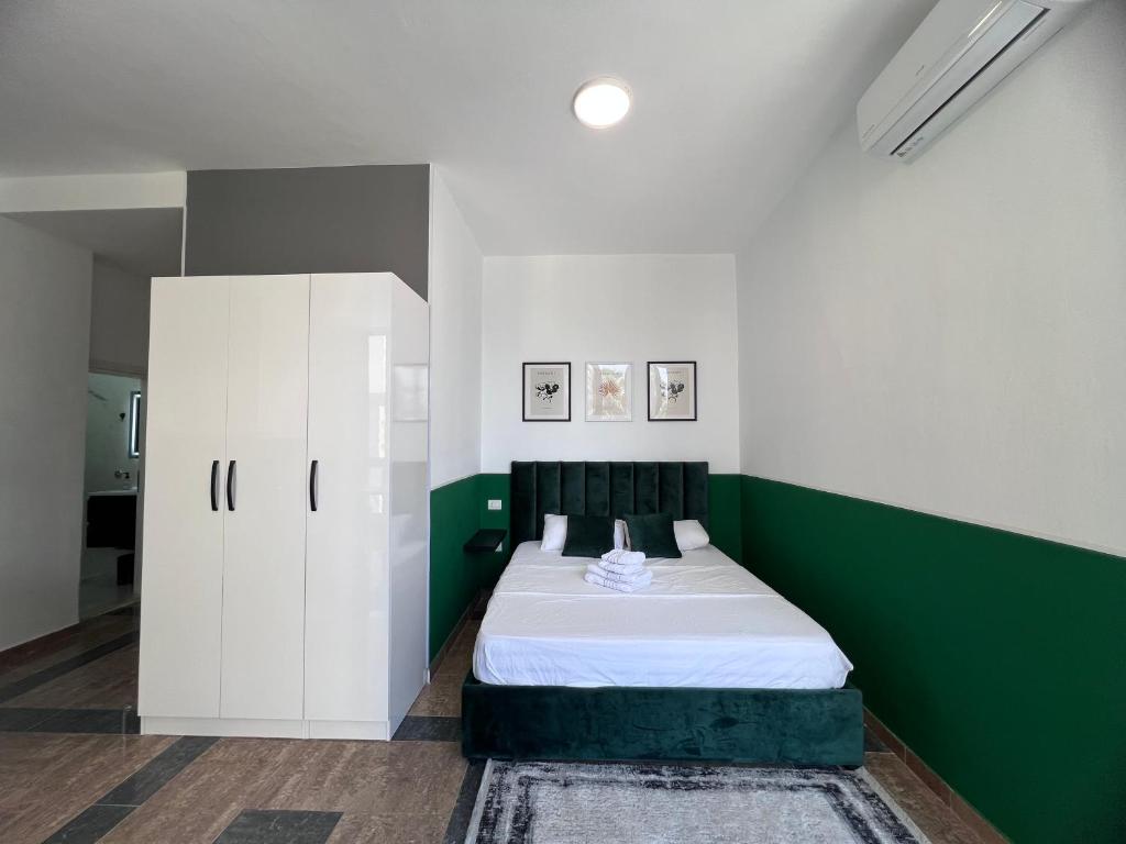 Postel nebo postele na pokoji v ubytování Cactus Apartments