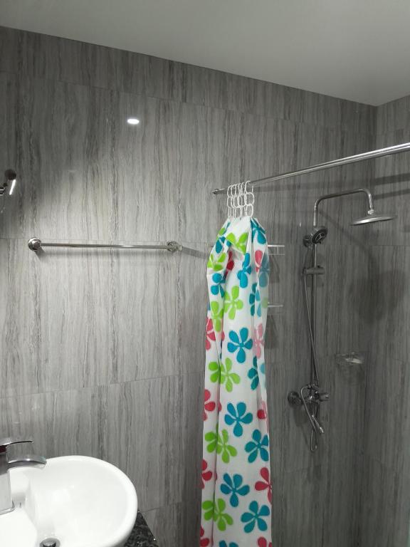 a shower curtain in a bathroom with a sink at Samayra's Apartment in Nadi