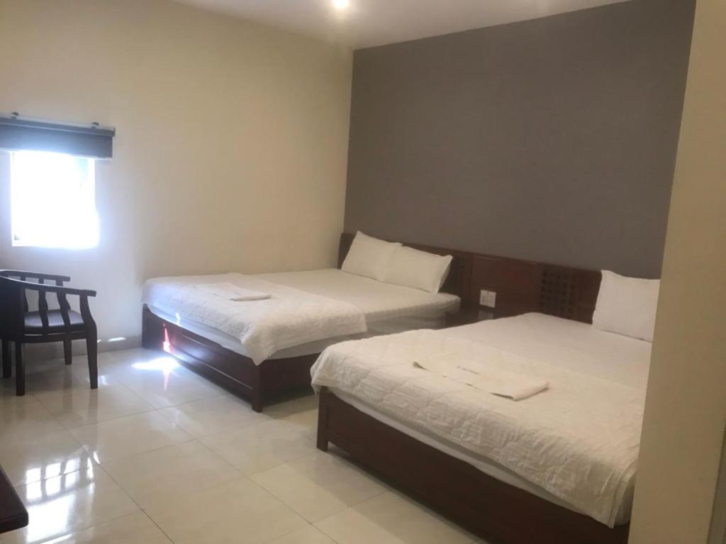 Postel nebo postele na pokoji v ubytování GOLD Hotel