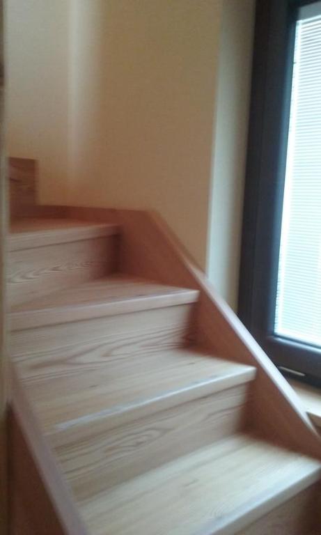 a set of stairs in a room with a window at Casa Vacanze Chez Sapin in Fenis