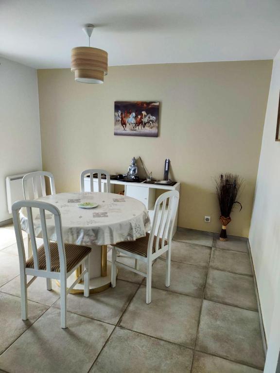 a dining room with a table and chairs at Maison de 2 chambres avec vue sur la mer jardin clos et wifi a Sete in Sète