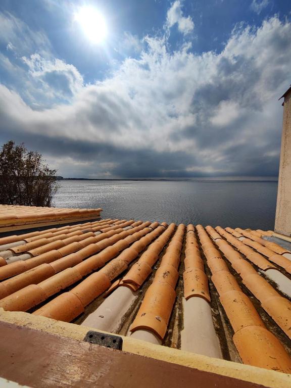 a group of pipes laying on top of the water at Maison de 2 chambres avec vue sur la mer jardin clos et wifi a Sete in Sète