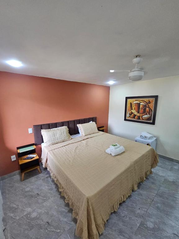 Uma cama ou camas num quarto em Hotel Pousada Bambuzal