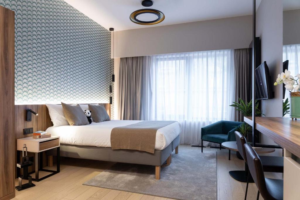 Postel nebo postele na pokoji v ubytování The Central Kirchberg - Smart ApartHotel