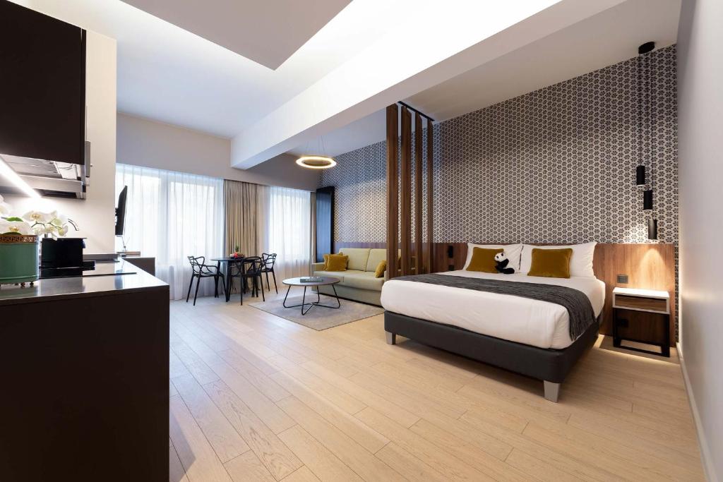 Postel nebo postele na pokoji v ubytování The Central Kirchberg - Smart ApartHotel