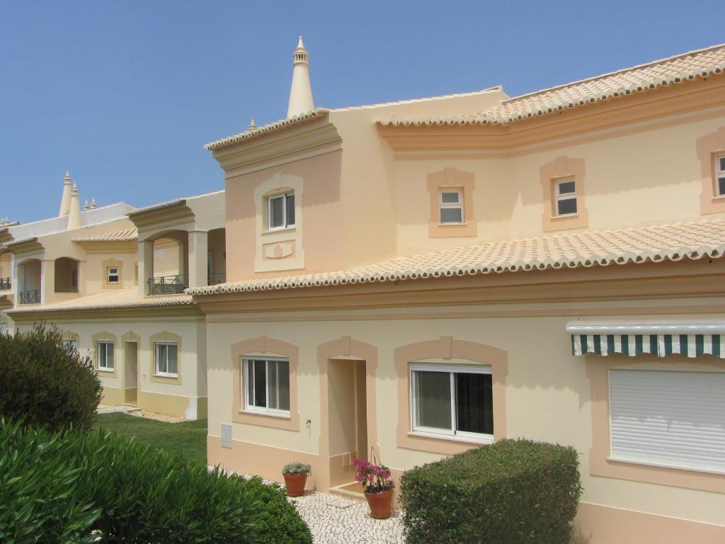 a large villa with a large house at Fairviews Villa on Boavista Golf Resort in Lagos
