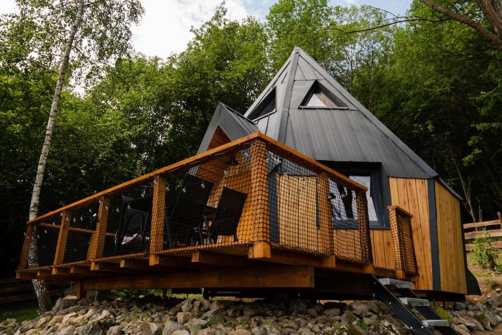 a house on top of a pile of rocks at Diamond Cabin Orava in Párnica