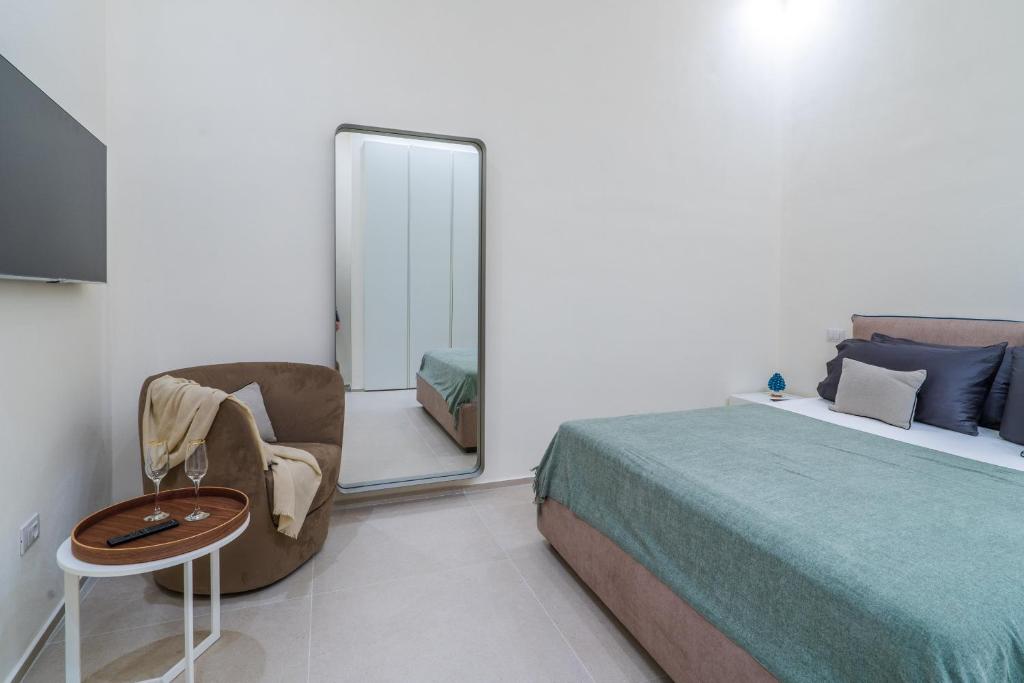 Postel nebo postele na pokoji v ubytování Vigliena rooms by Dimore in Sicily
