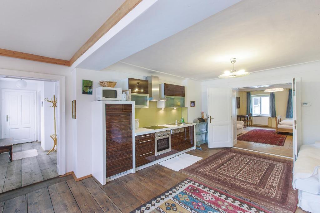 a kitchen with a refrigerator and a counter top at Stadthaus Mariazell in Mariazell