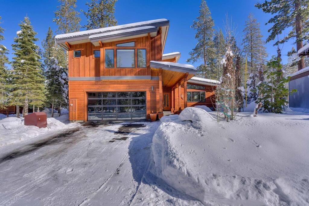 a log home in the snow with a driveway at Palisades Tahoe Mountain Oasis in Olympic Valley