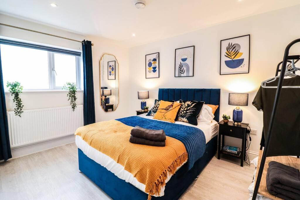 a bedroom with a large bed and a window at Dulwich House - Long Stay Offer - 2 mins to Station in London