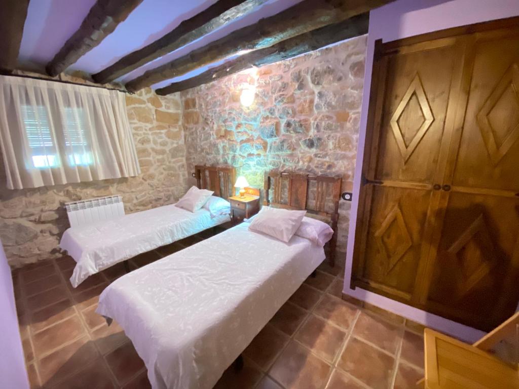Postel nebo postele na pokoji v ubytování Mas de Nofre