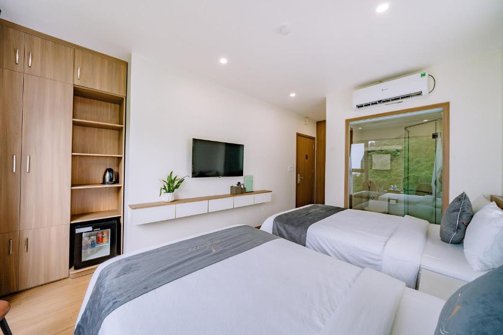 TV a/nebo společenská místnost v ubytování CAT BA ECO HOTEL