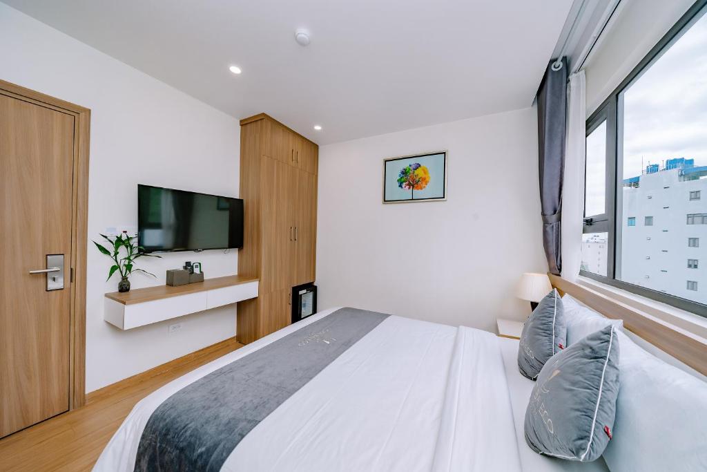 Postel nebo postele na pokoji v ubytování CAT BA ECO HOTEL