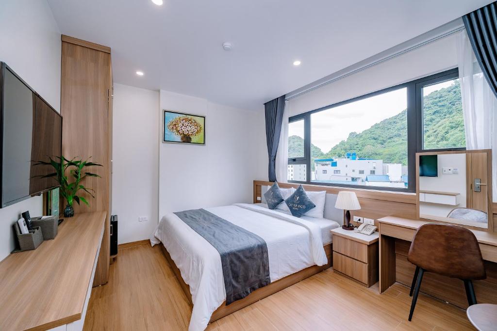Postel nebo postele na pokoji v ubytování CAT BA ECO HOTEL