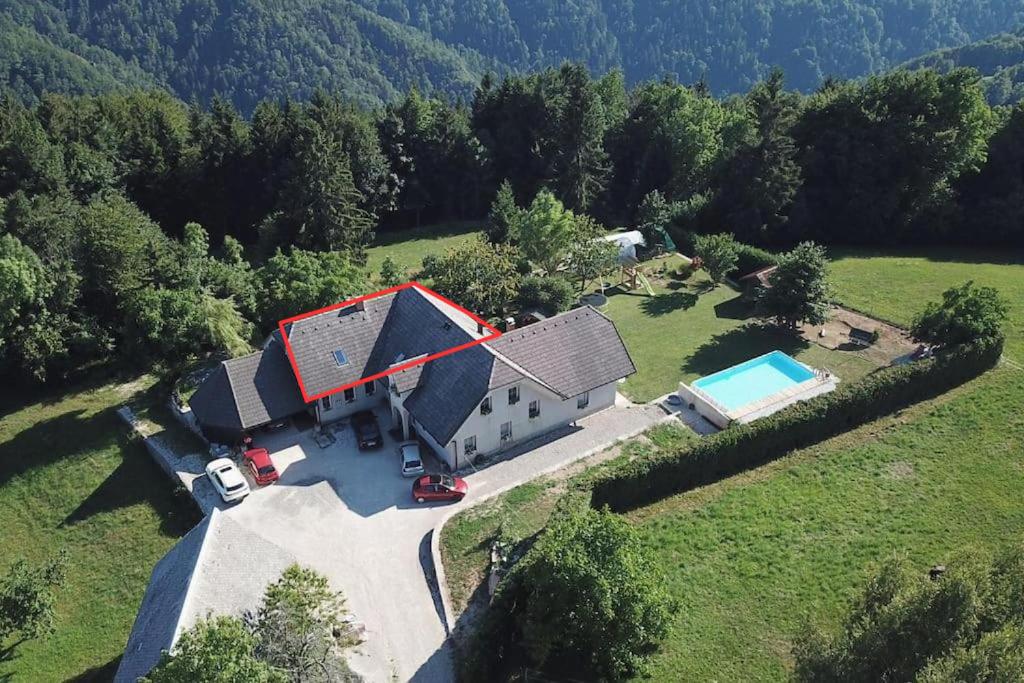an aerial view of a house with a swimming pool at Apartment Sofia in Idrija