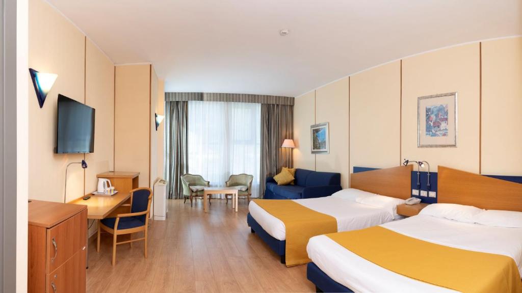 Postel nebo postele na pokoji v ubytování Hotel Express Aosta East