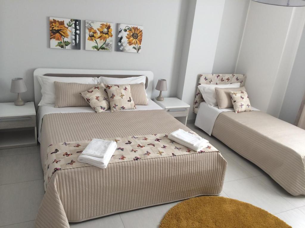 Postel nebo postele na pokoji v ubytování Pietra Bianca Rooms
