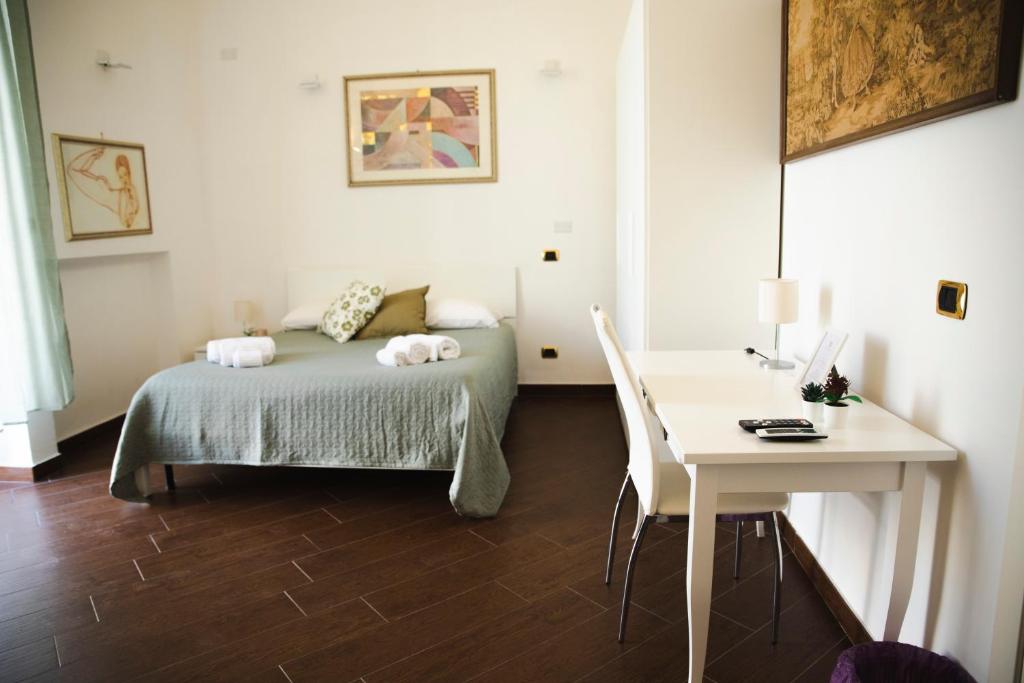 A bed or beds in a room at Palazzo de Brado