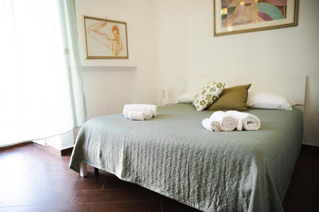 A bed or beds in a room at Palazzo de Brado