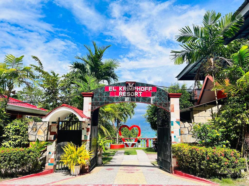 an entrance to a resort with a sign that reads let my honeymoon resort at El Krimphoff Resort in Romblon