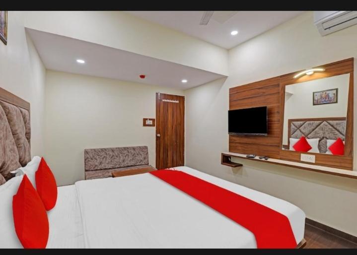 Postel nebo postele na pokoji v ubytování hotel swagat inn
