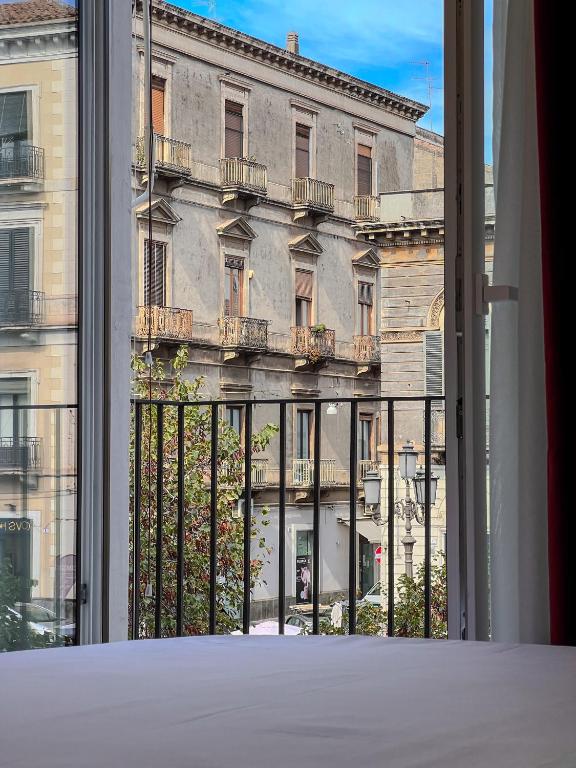 Postel nebo postele na pokoji v ubytování Ricci Palace Suites