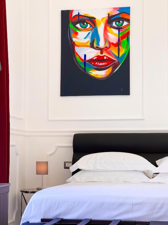 Postel nebo postele na pokoji v ubytování Ricci Palace Suites