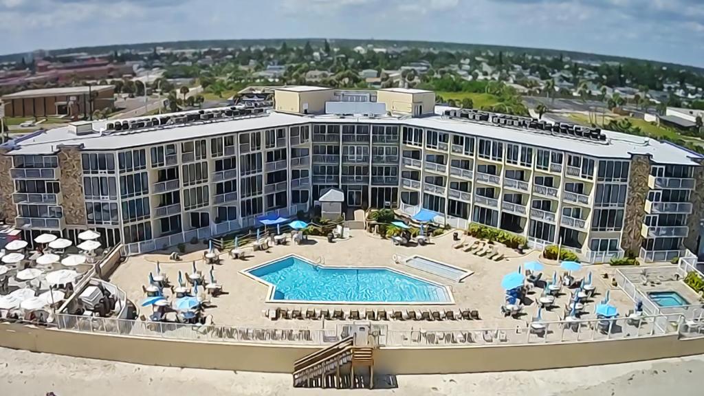 an aerial view of a resort with a swimming pool at Ocean East Resort Club in Ormond Beach