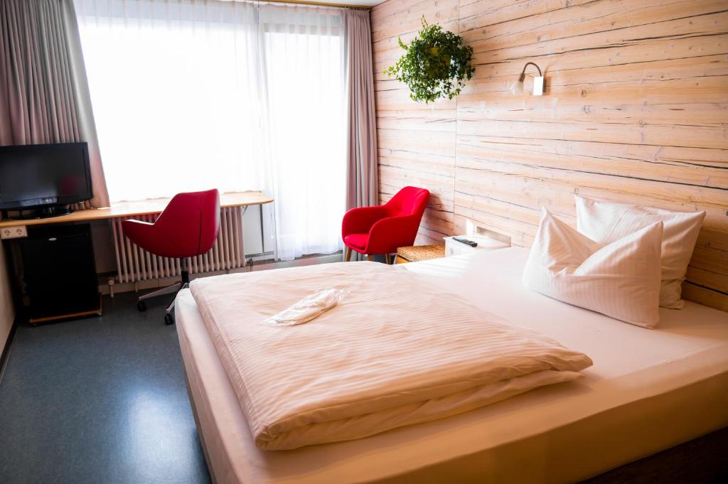 Postel nebo postele na pokoji v ubytování Abalon Hotel ideal