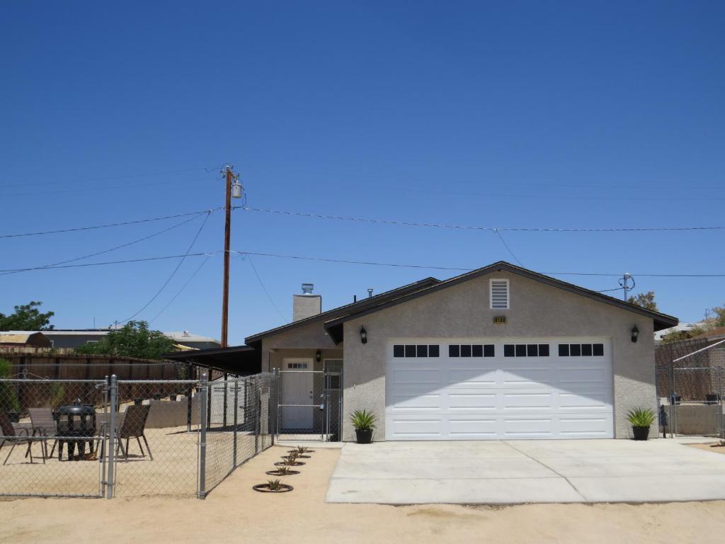 a garage with a large white garage door at Panoramic Night Lights in Joshua Tree