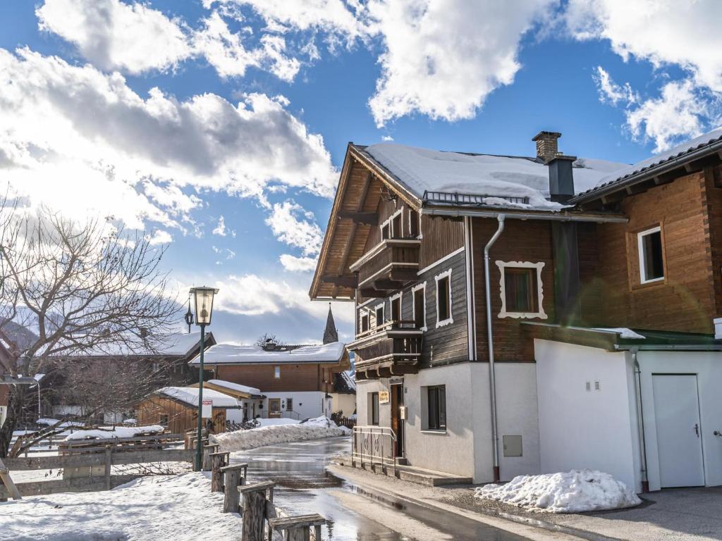 a house with snow on the roof at Kitzbüheler Alpen L in Bramberg am Wildkogel