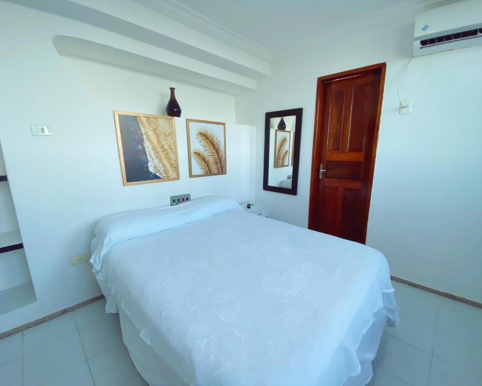 Cama ou camas em um quarto em Hotel 5 Sóis