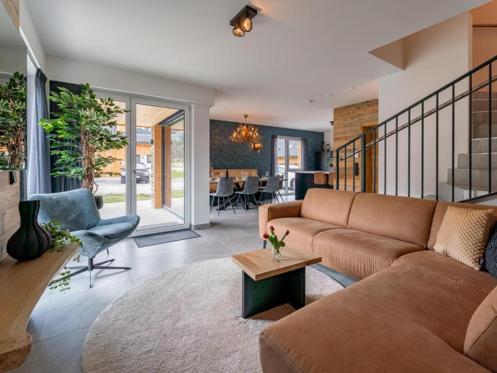 a living room with a couch and a table at Bergzicht 2B in Sankt Lorenzen ob Murau
