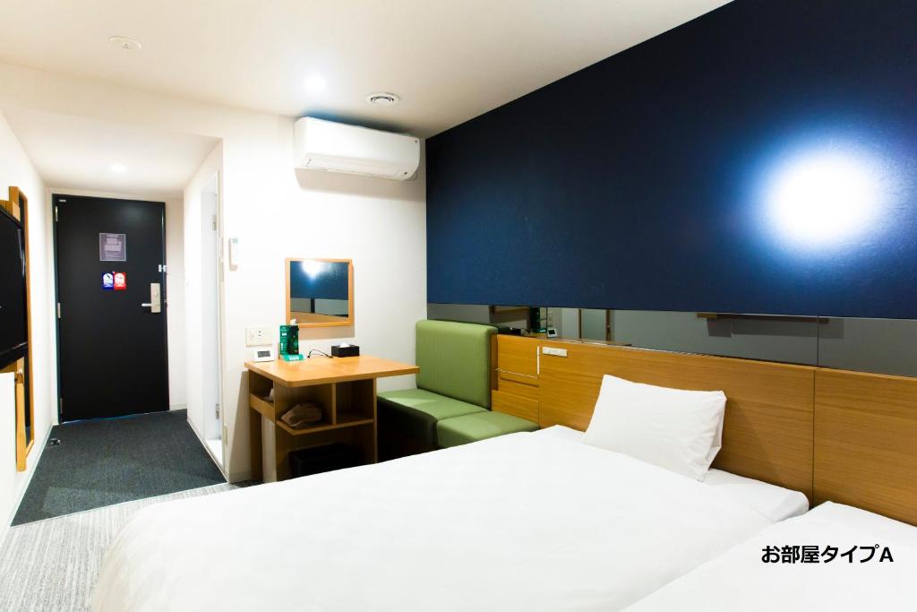 Postel nebo postele na pokoji v ubytování Hotel Meldia Kyotoshijoomiya