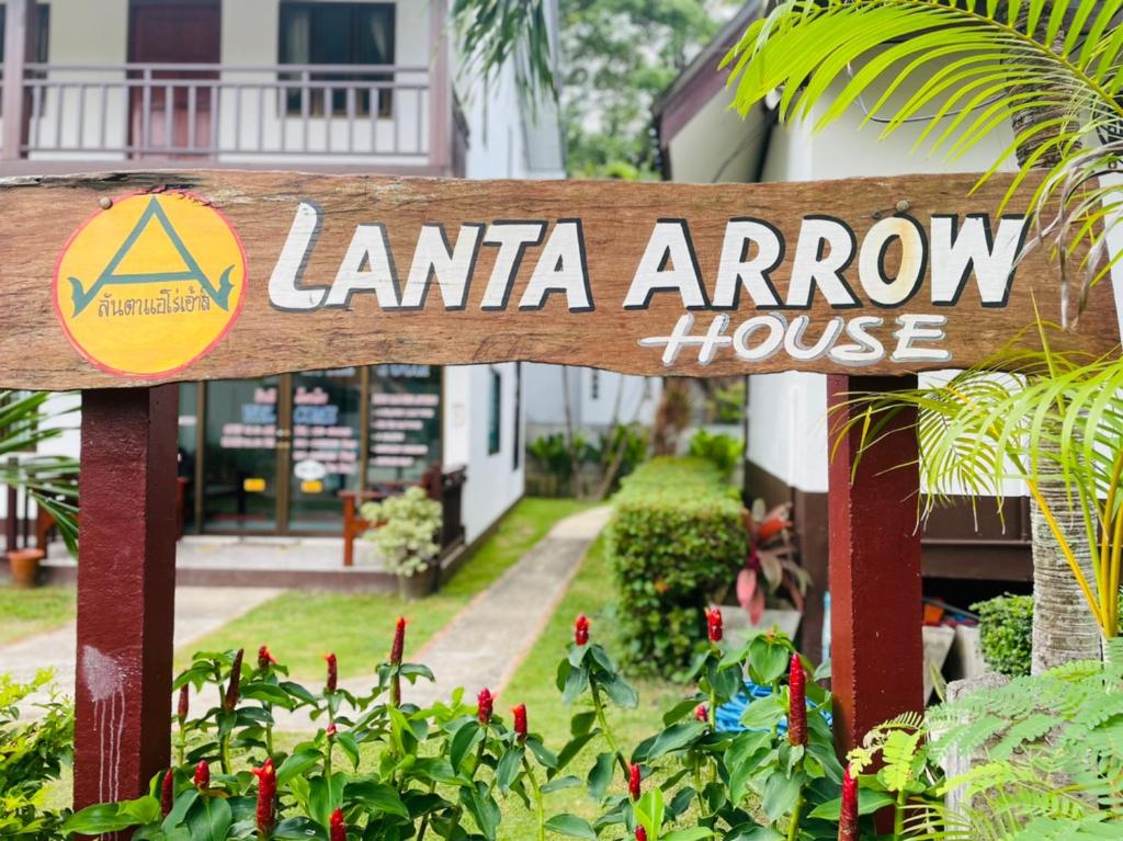 a sign that readsiane arrow house in front of a house at Lanta Arrow House in Ko Lanta