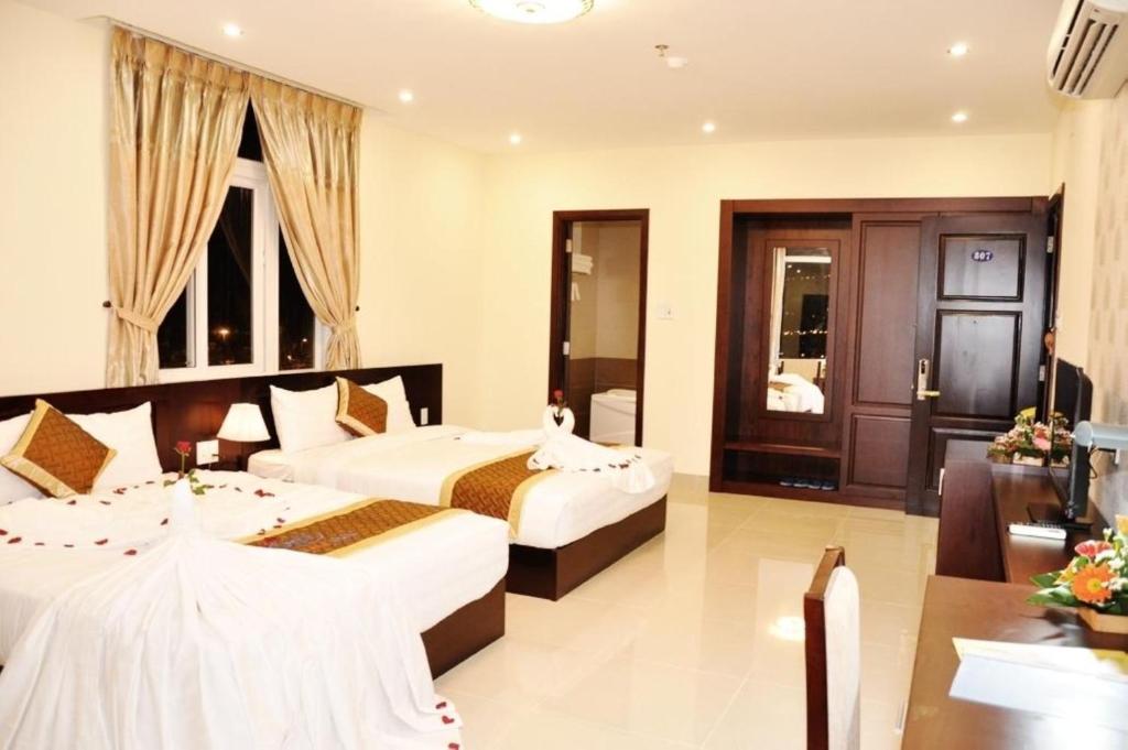 Letto o letti in una camera di Sunview Beach Hotel Danang