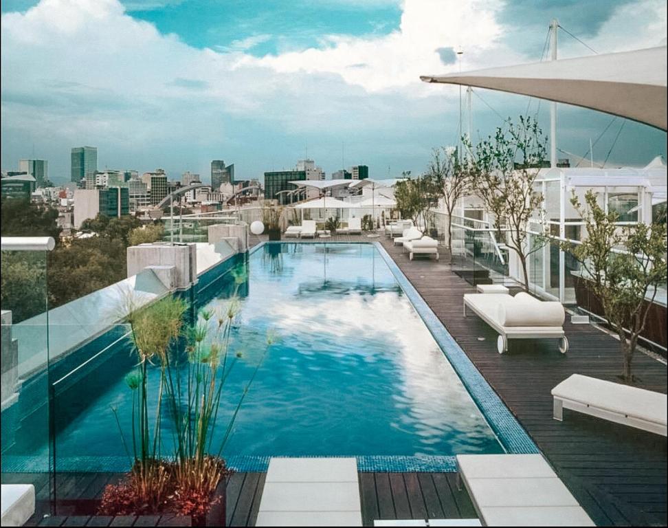 a large swimming pool on top of a building at Central Park Condesa in Mexico City