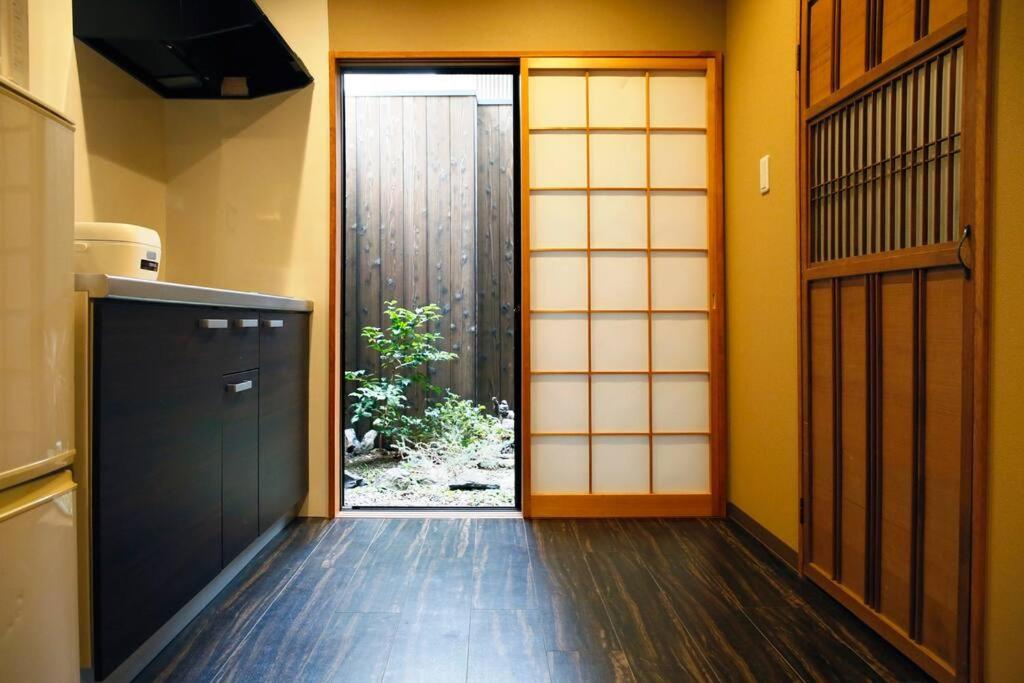 an entrance to a room with an open door at Kyokoi Toujimikuni in Kyoto