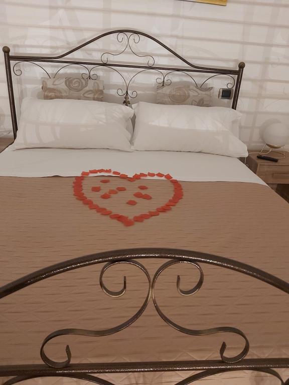 Postel nebo postele na pokoji v ubytování Dimora Margherita