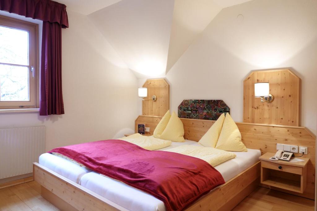 Postel nebo postele na pokoji v ubytování Hotel Malteinerhof