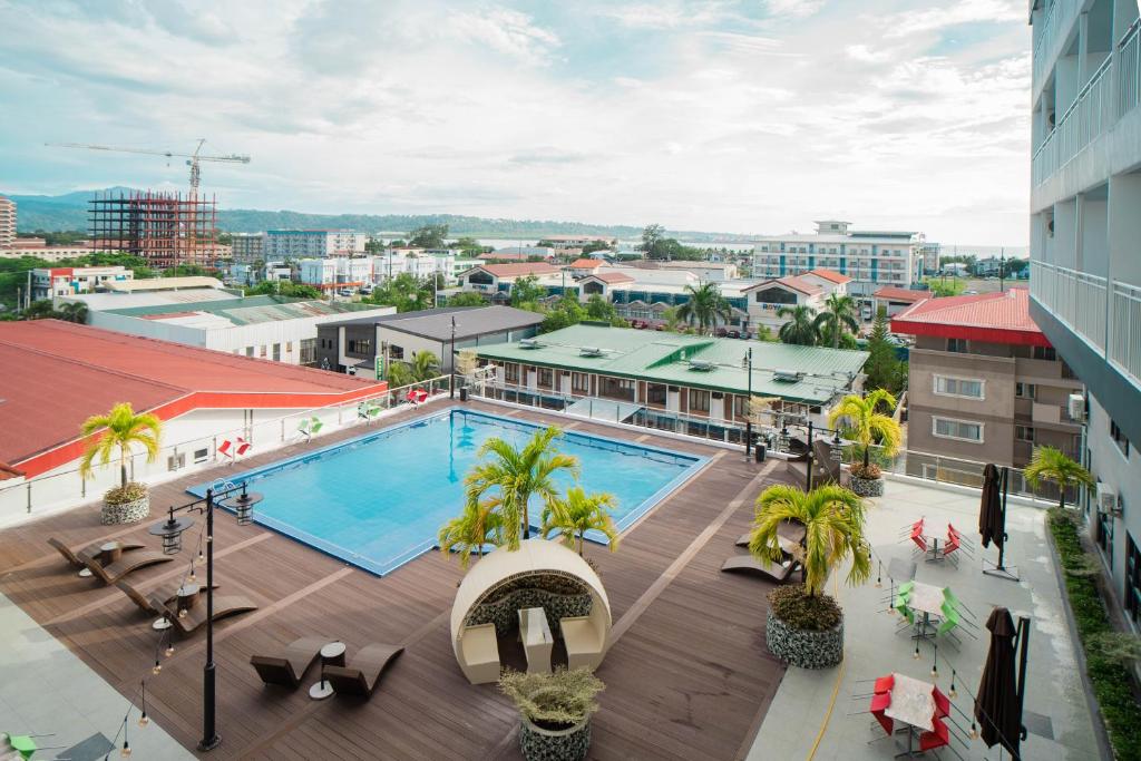 an overhead view of a pool on top of a building at Subic Riviera Hotel & Residences in Kababae