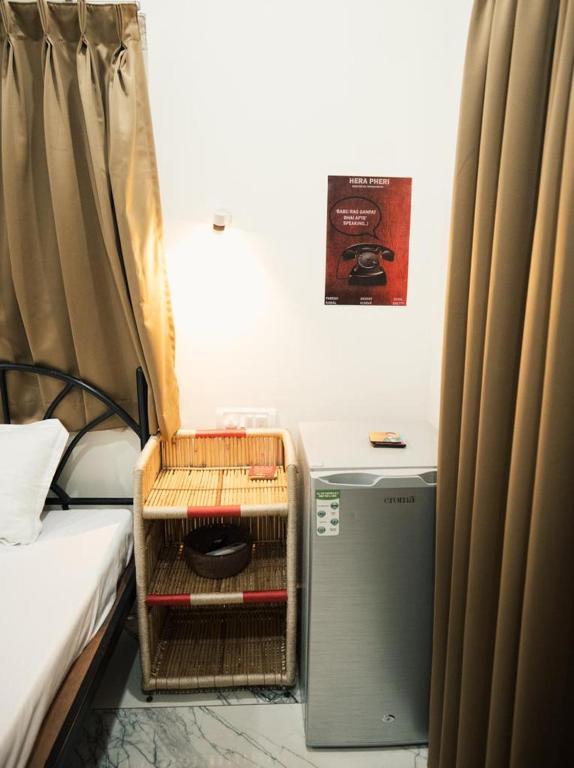 Postel nebo postele na pokoji v ubytování Nirvana Homestays