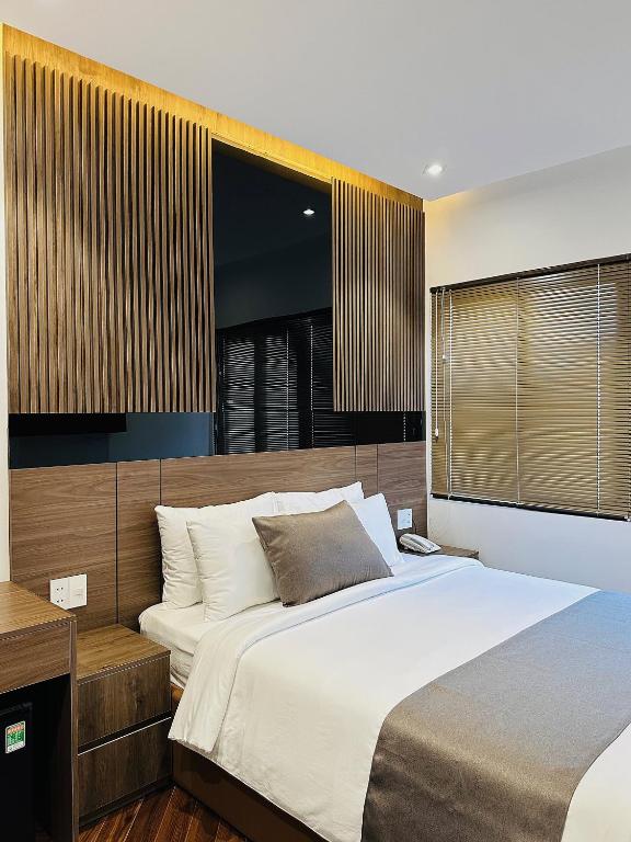 Giường trong phòng chung tại Hải Long Hotel 2