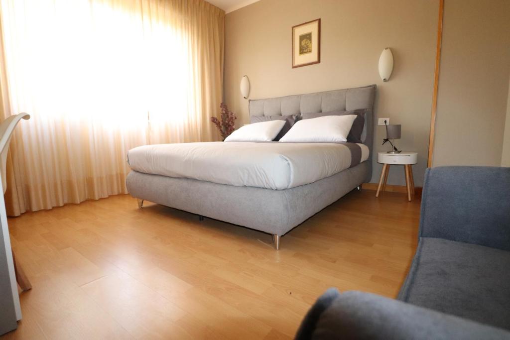 Postel nebo postele na pokoji v ubytování Hotel Rio Umbertide