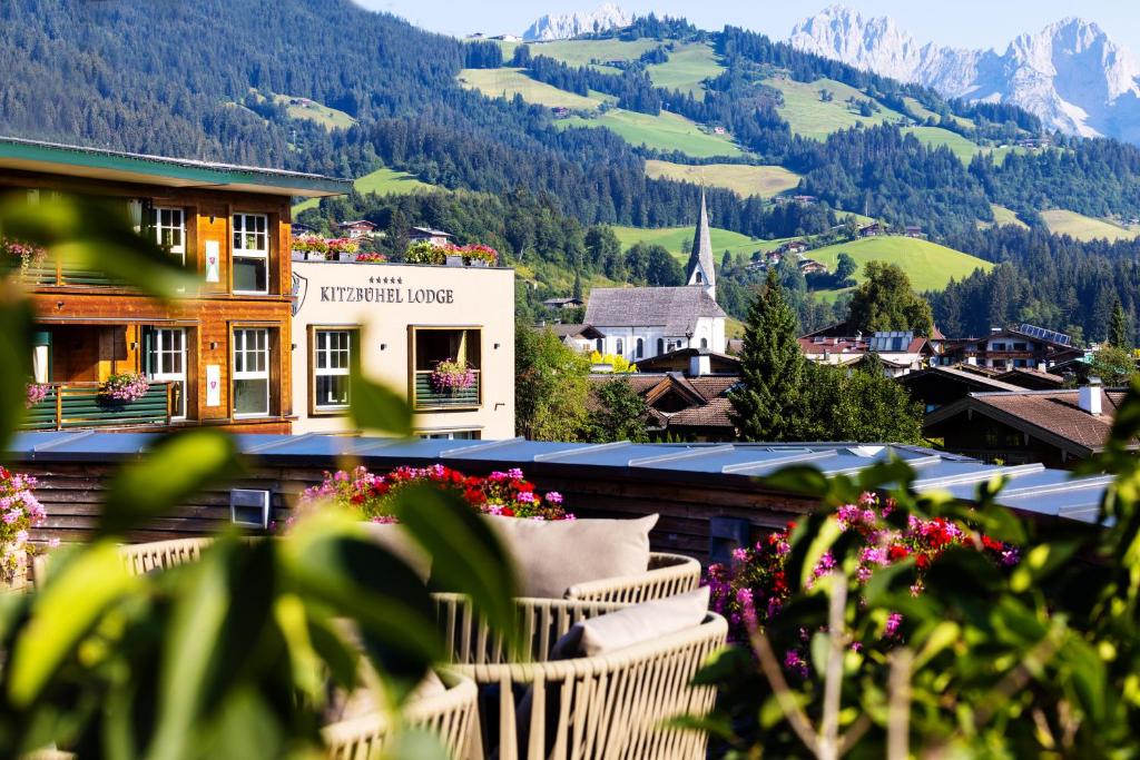 a view of a town with mountains in the background at Kitzbühel Lodge in Reith bei Kitzbühel