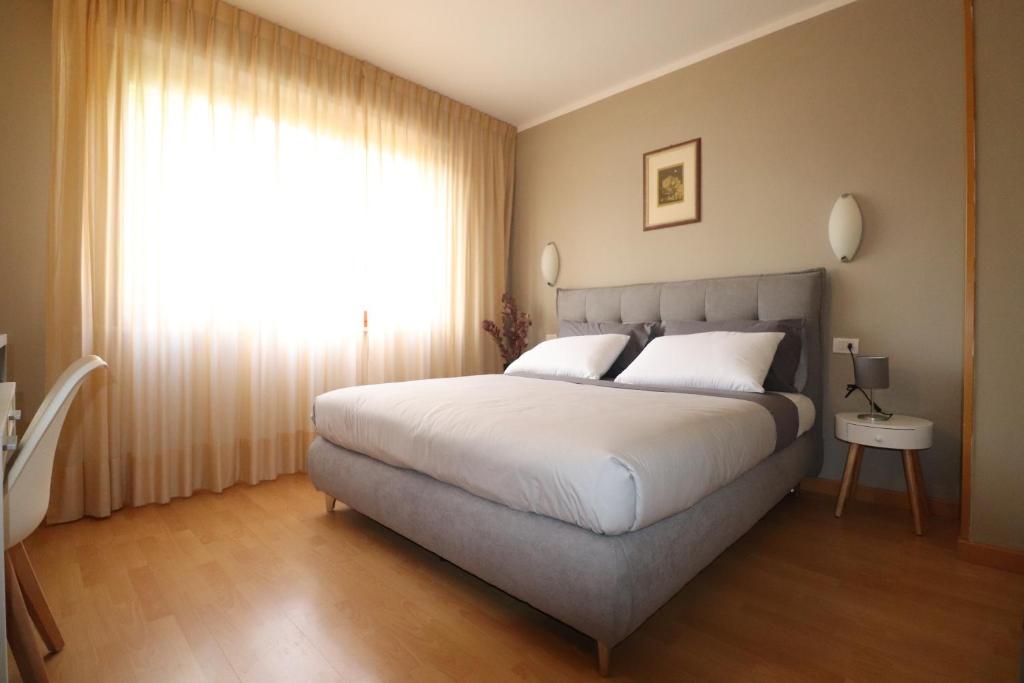 Postel nebo postele na pokoji v ubytování Hotel Rio Umbertide