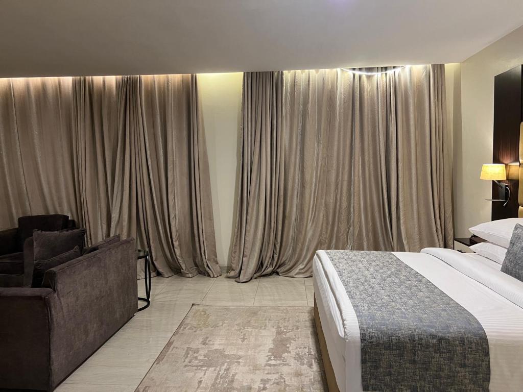 Voodi või voodid majutusasutuse Rollace Hotel toas