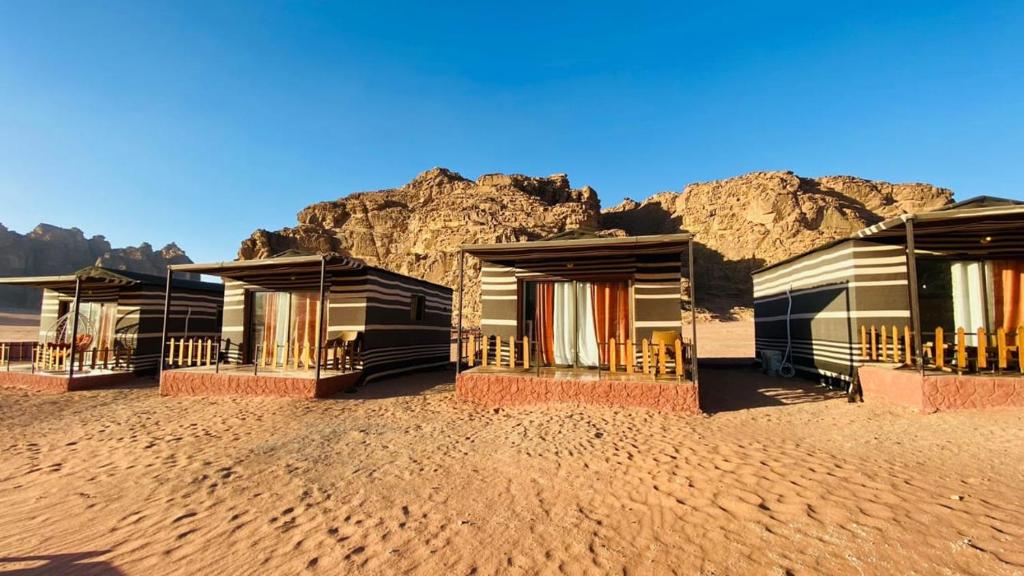 a row of houses in the middle of the desert at camp scylla Wadi Rum in Wadi Rum